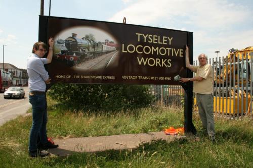 The new sign being handed over to Vintage Trains