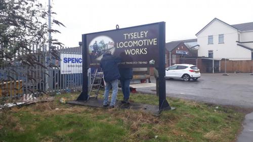 The new sign being installed